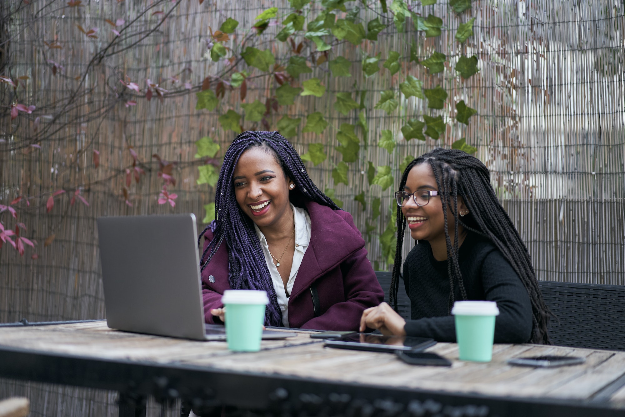 Modern Gadgets For Study. Group Of College Students Sitting Outdoors